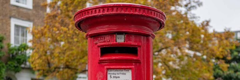 red post box in autumn